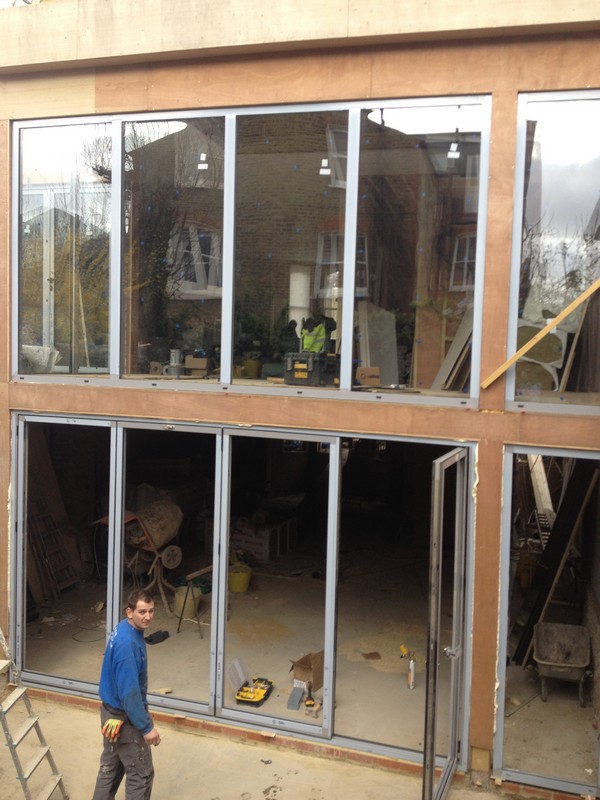 Aluminium bi-fold doors with two-storey glazing in Manor Park