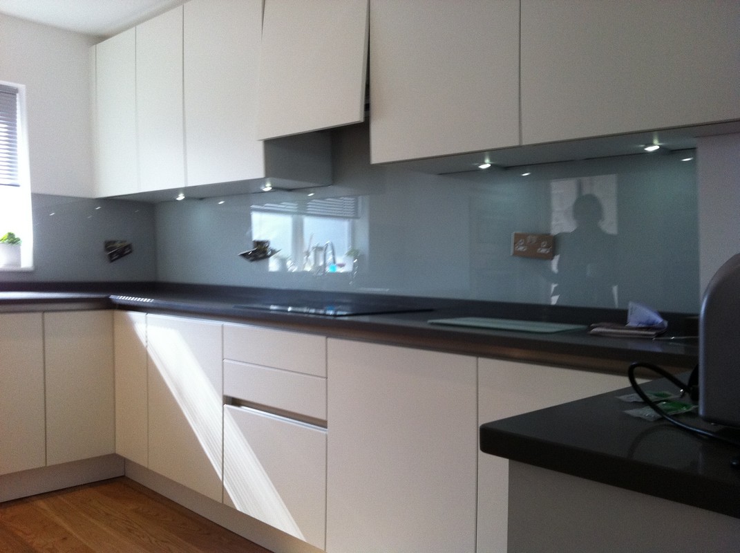 Grey glass kitchen splashback with LED lighting in Manor Park