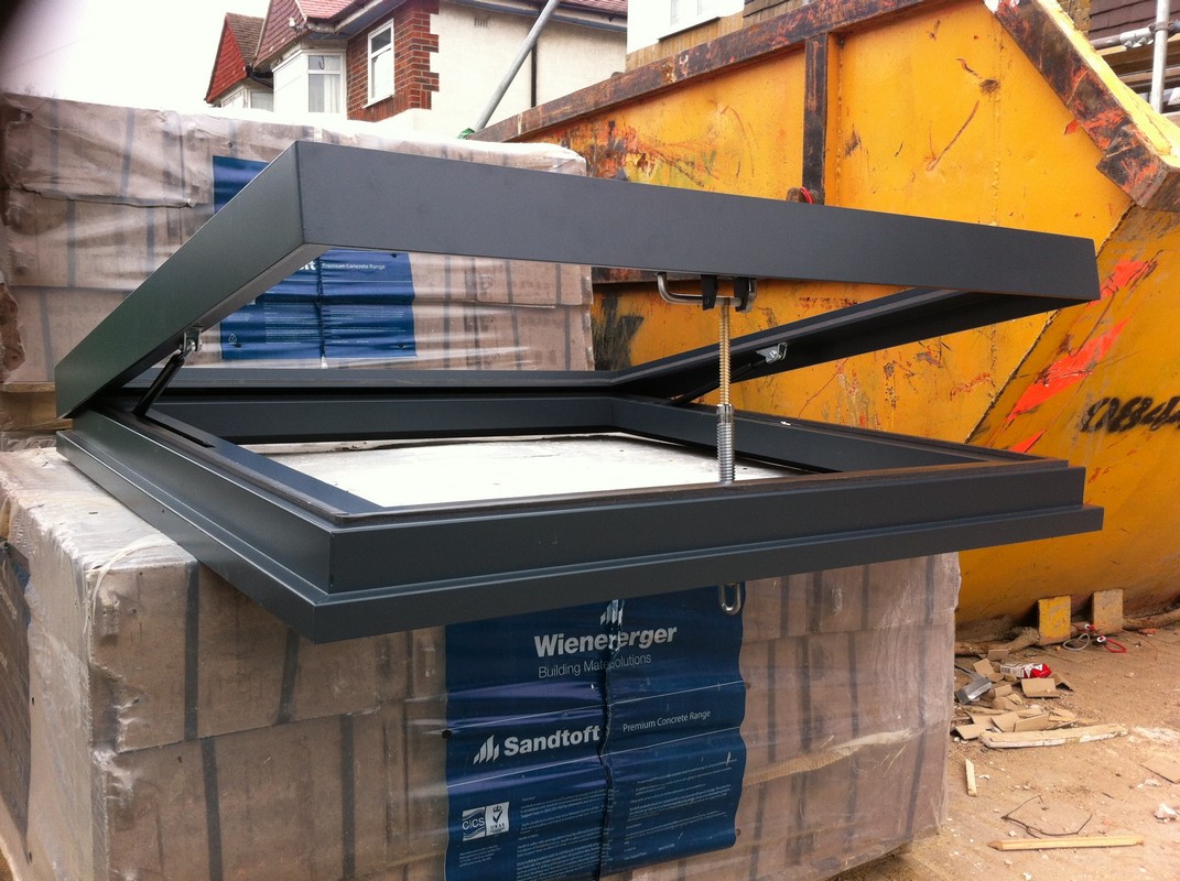 Opening flat roof skylight in anthracite grey installed in Manor Park